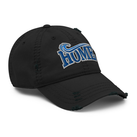 A black distressed baseball cap featuring a blue and white embroidered 'HOME'  with a wave design on the front