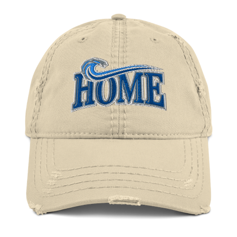 A beige distressed baseball cap featuring a blue and white embroidered 'HOME' logo with a wave design on the front
