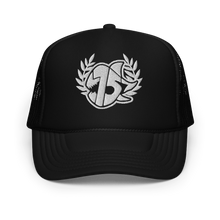 A black trucker hat with a white embroidered logo on the front, set against a plain white background.