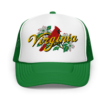 A white and kelly green trucker hat featuring a graphic on the front panel with a red cardinal, white dogwood flowers, green leaves, and the word 'Virginia' in yellow script.