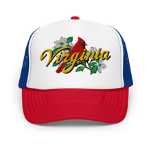 A white, blue, red trucker hat featuring a graphic on the front panel with a red cardinal, white dogwood flowers, green leaves, and the word 'Virginia' in yellow script.