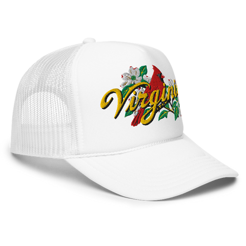 A white trucker-style cap with a curved brim, featuring an embroidered front graphic of a red cardinal, white dogwood flowers, green leaves, and the word 'Virginia' in yellow script