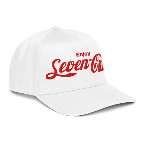 A white baseball cap with red embroidered text reading 'Enjoy Seven Cities' on the front, shown against a plain white background.